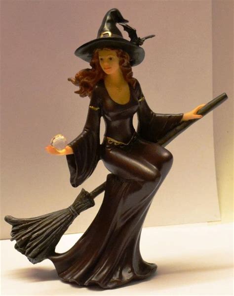 Witch figurine before sunrise